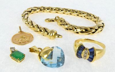 a lot of jewelry that is laying out on a table