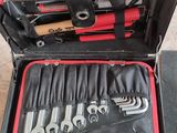 a tool case with tools inside of it on the floor