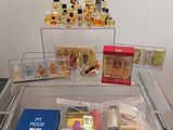 a glass table with a lot of perfumes on top of it