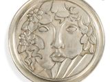an image of a silver coin with a woman ' s face on it