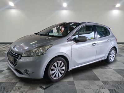 a picture of a silver car parked in a showroom