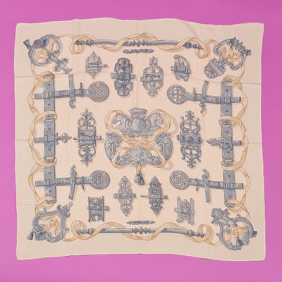an image of a blue and white scarf on a pink background