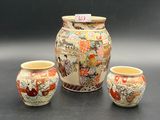three vases sitting next to each other on a table