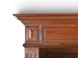 a close up of a wooden shelf with a clock on top of it
