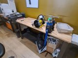a desk with a computer and printer on it in a room