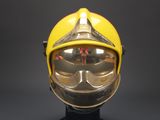 yellow fireman helmet with goggles and goggles on display