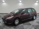 a picture of a maroon minivan parked in a garage