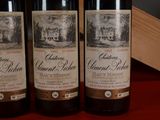 three bottles of wine that are sitting on a table