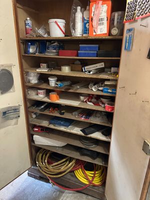 a cabinet with a lot of tools on top of it