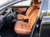 the interior of a car with two leather seats and a steering wheel