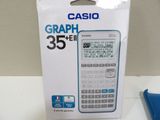 a box with a calculator inside of it on a table