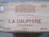 a wooden box with a label on it that says chateau la dauphinne