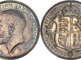 a close up of a coin with a man ' s face on it