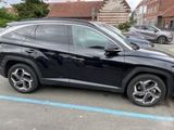 a picture of a black suv parked in a parking lot