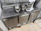 a kitchen counter with a mixer and a bowl on it