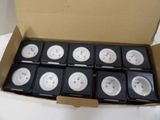 a cardboard box with a bunch of white and black electrical plugs