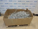 a cardboard box filled with lots of silver foil