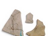 two pieces of pottery are shown on a white surface