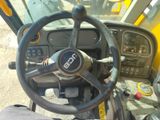 a close up of a steering wheel on a construction vehicle
