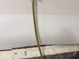 a hose attached to a wall with a hose attached to it