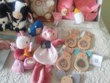 many stuffed animals and toys on the bed