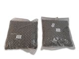 two bags of food sitting on top of each other on a white surface