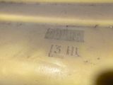 a close up of a yellow vase with a number on it