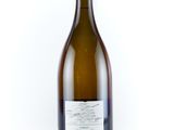 the bottle of wine is empty on the white surface