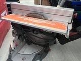 an image of a table saw in a warehouse