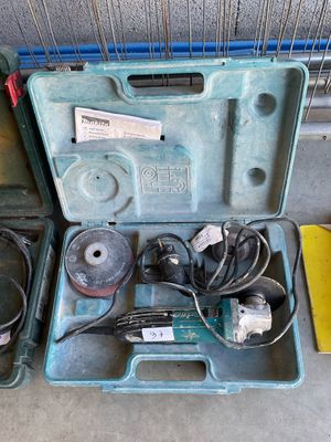 two tools in a case on the floor next to each other