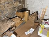 a pile of boxes sitting on the floor in a room