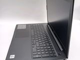 a black laptop with a black keyboard on a white table
