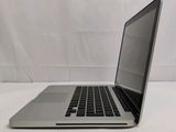 a laptop computer sitting on a table with a white background