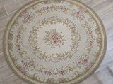 a round rug on the floor in a room