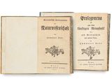an old book opened to show the front and back pages of a book