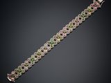 a bracelet with multicolored stones on a black background