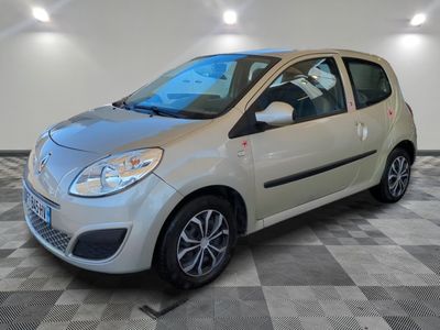 a picture of a small silver car on a checkered floor
