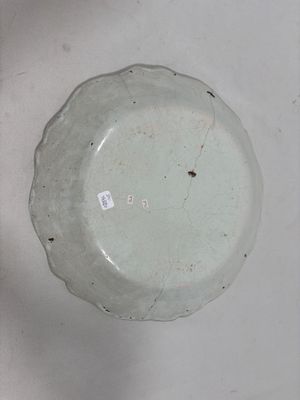 a white plate that has a small hole in it