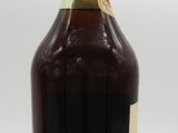 an image of a bottle of liquor sitting on a table