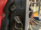 a close up of a red and black engine on a motorcycle