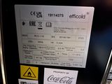 a picture of a close up of a coca cola machine