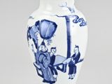 blue and white vase with a woman on a horse and a man on a horse