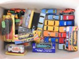 a box full of toy cars and trucks in it