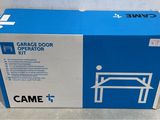 a cardboard box with a picture of a garage door operator ' s kit