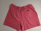 a pair of pink swim shorts on a white surface