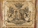 a close up of a tapestry with a picture of a castle on it
