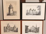 four framed drawings of a castle and a church on a table