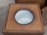 two wooden boxes with a toilet and a bowl on them