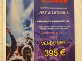 a poster on the wall of a restaurant advertising art and lutherie