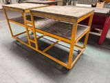 two tables that are sitting on the floor in a warehouse